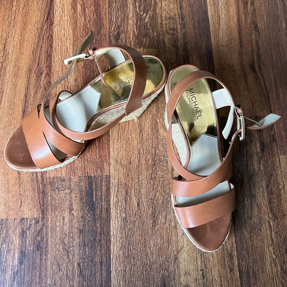 Brown wedges with gold hardware.